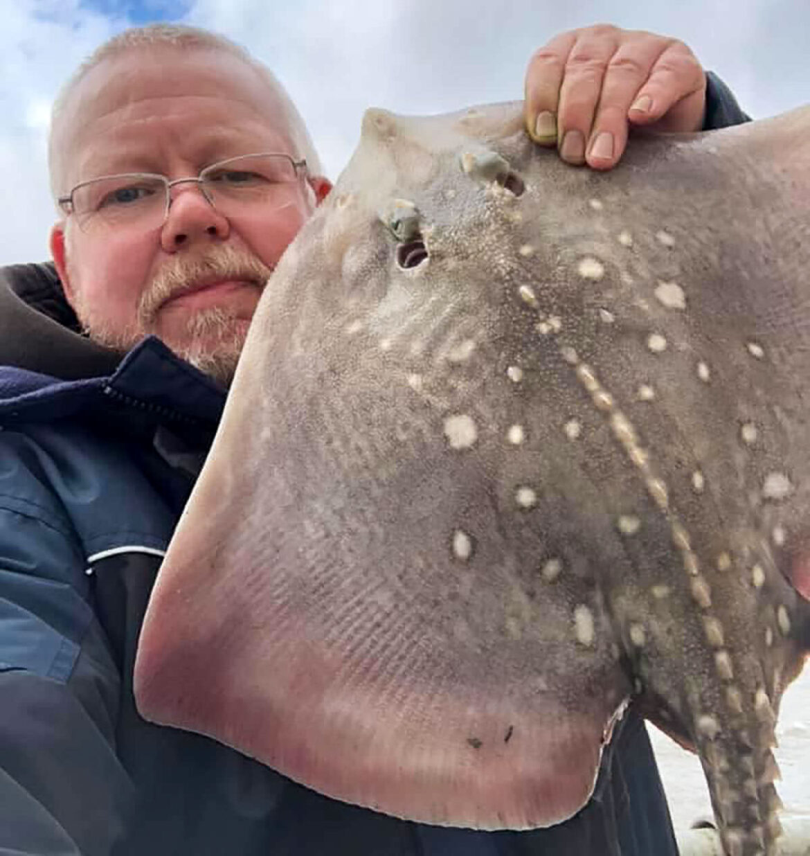 Allan pictured with a thornback ray