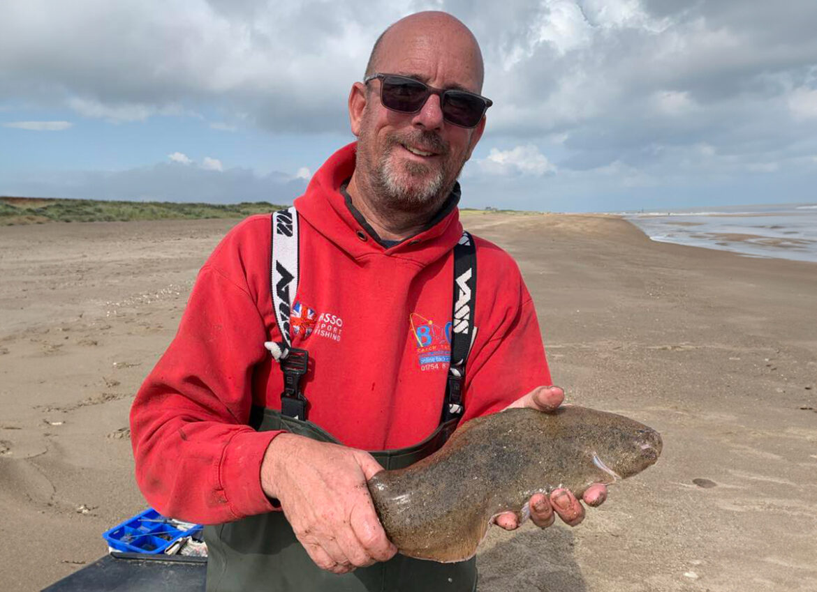 Match winner Paul Denholm with the longest flatfish