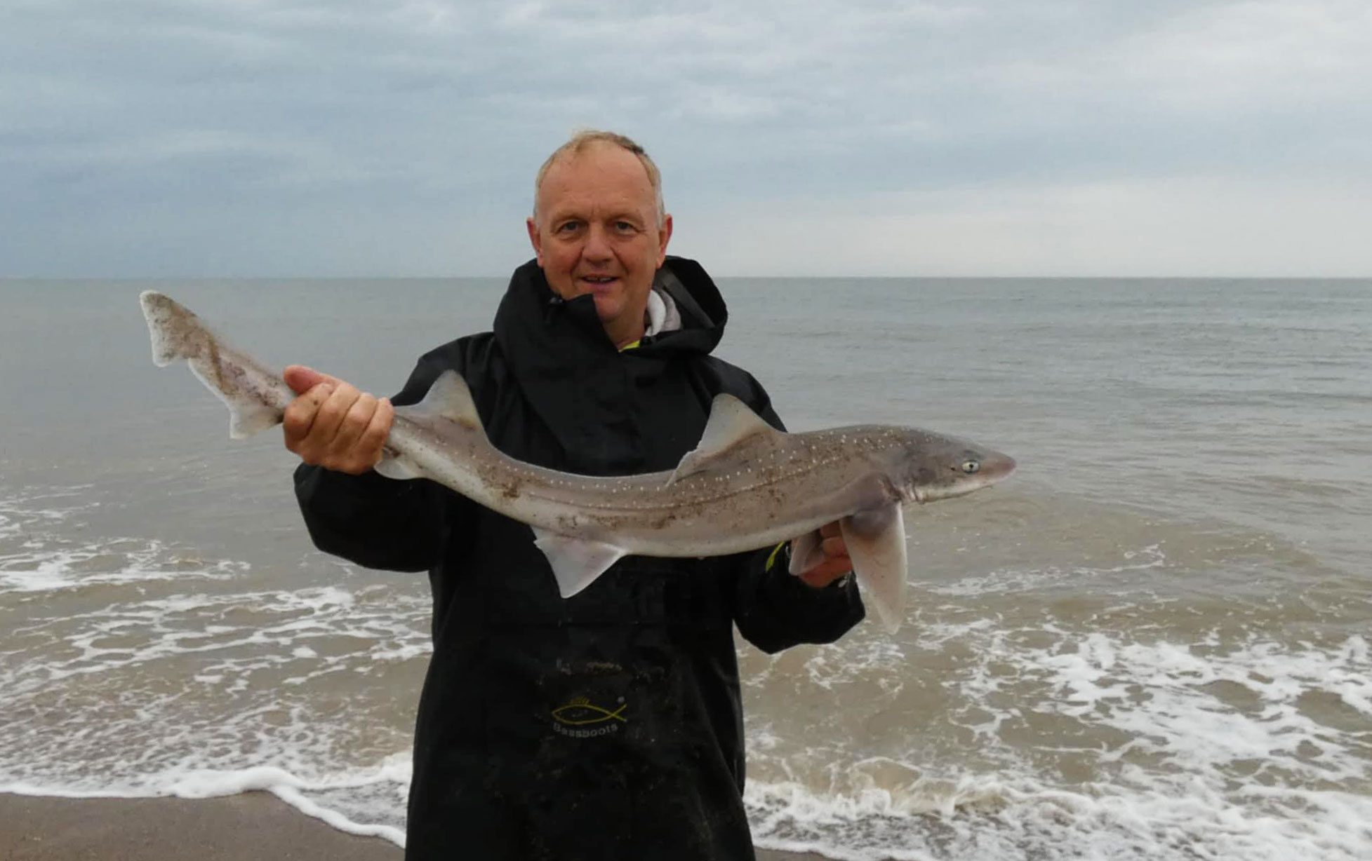 Match winner Karl Nangle with one of his four hounds for 381cm