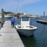 Dave Bois at boat moored in marina