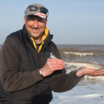 Match winner Adie Cooper with his first fish of the match, a 47cm hound pup Match winner Adie Cooper with his first fish of the match, a 47cm hound pup