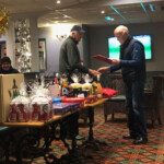 Chas presenting Gordon Nelson with the longest flatfish prize at the raffle Chas presenting Gordon Nelson with the longest flatfish prize at the raffle