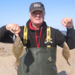 Match angler Tony Burman with one of his double shots two flounders, he followed this with a bass and flounder double shot Match angler Tony Burman with one of his double shots two flounders, he followed this with a bass and flounder double shot