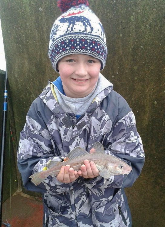 Jayden Ferris, aged 9 with his first fish