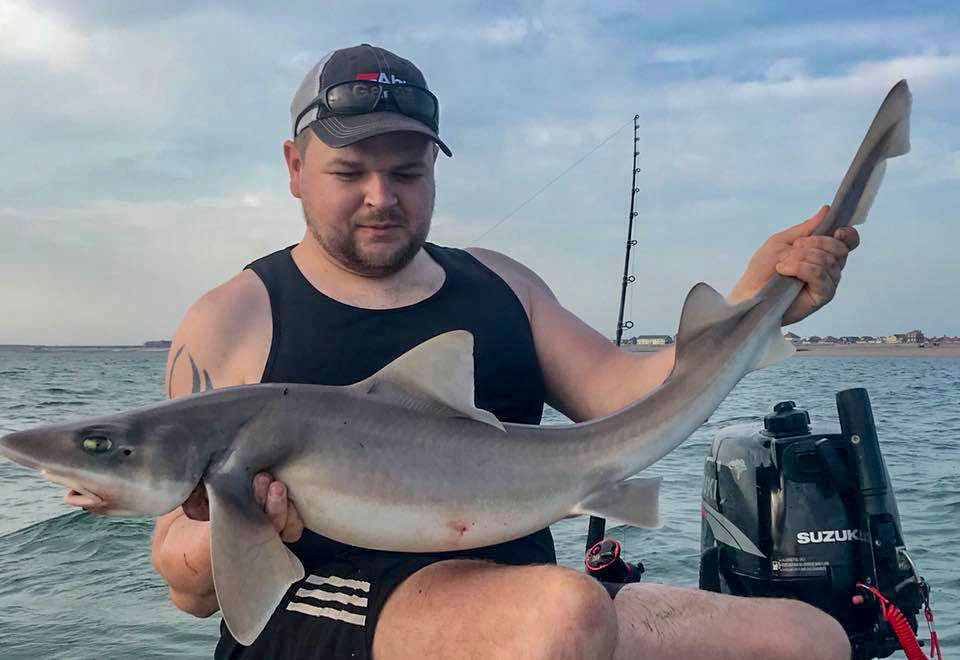 jordan with a double figure hound from his dinghy 